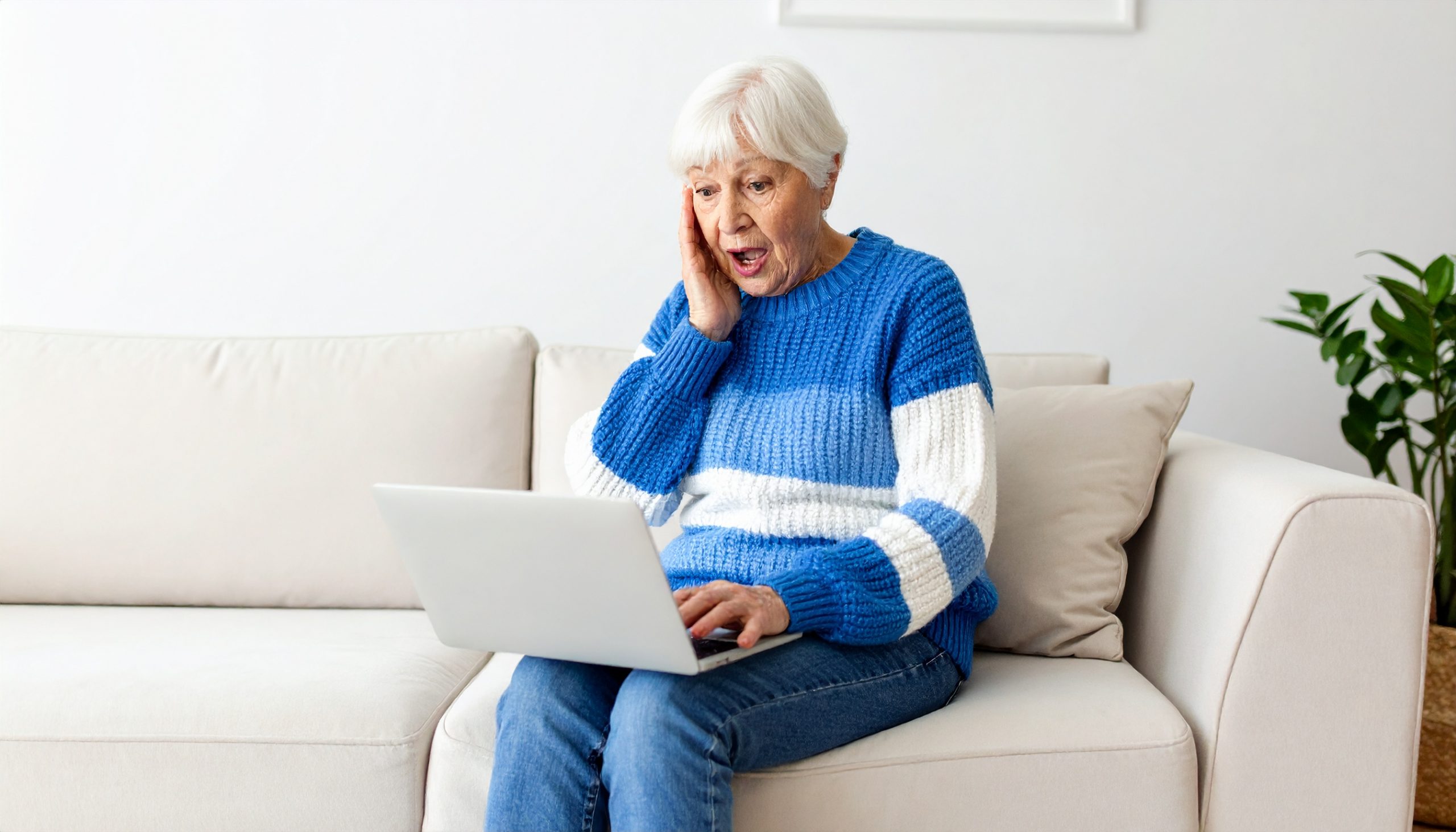 Grandmother hearing false news on her laptop