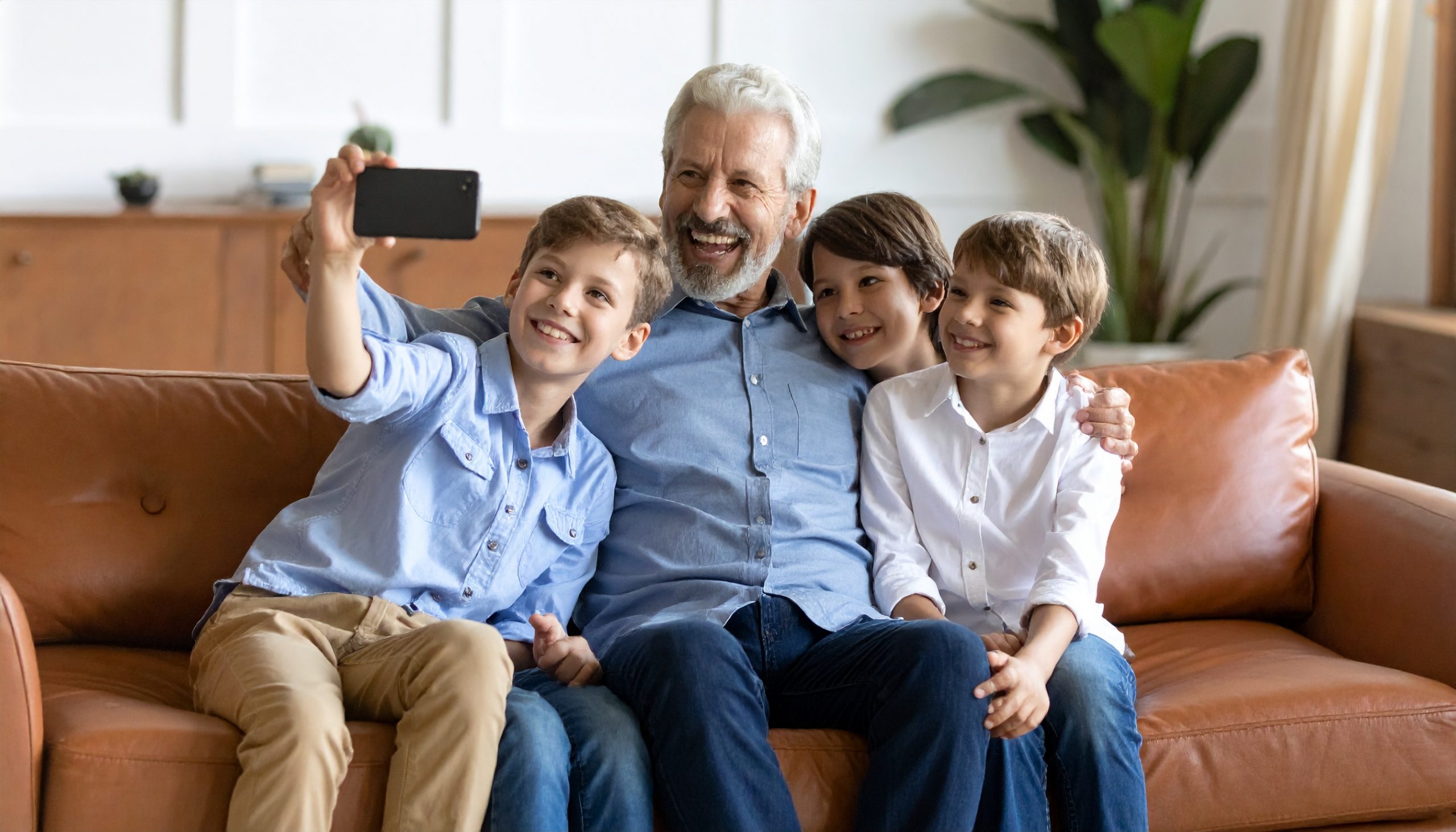Grandpa taking selfies with his 3 grandchildren