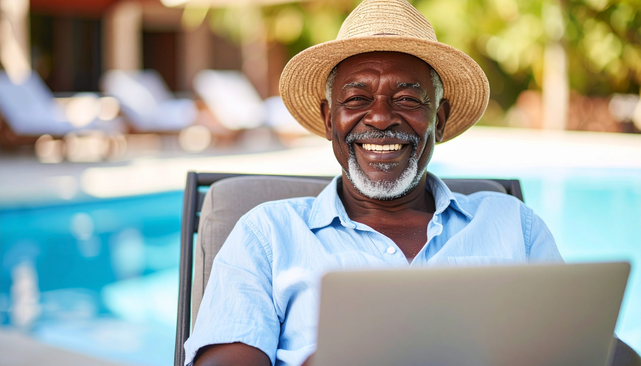 Male Senior relaxing and smiling by pool.