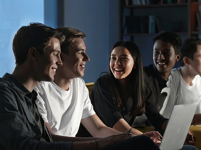 High school students laughing at a bullying video on Social Media
